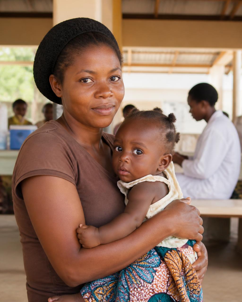 Caregiver and child at a community health clinic